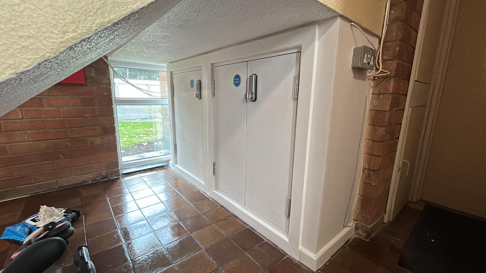 Completed FireQual-certified fire door installation around an electric cupboard, Liverpool