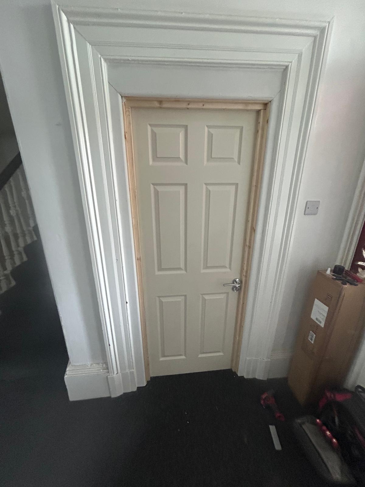 Standard internal door before FireQual fire door upgrade in a Merseyside property